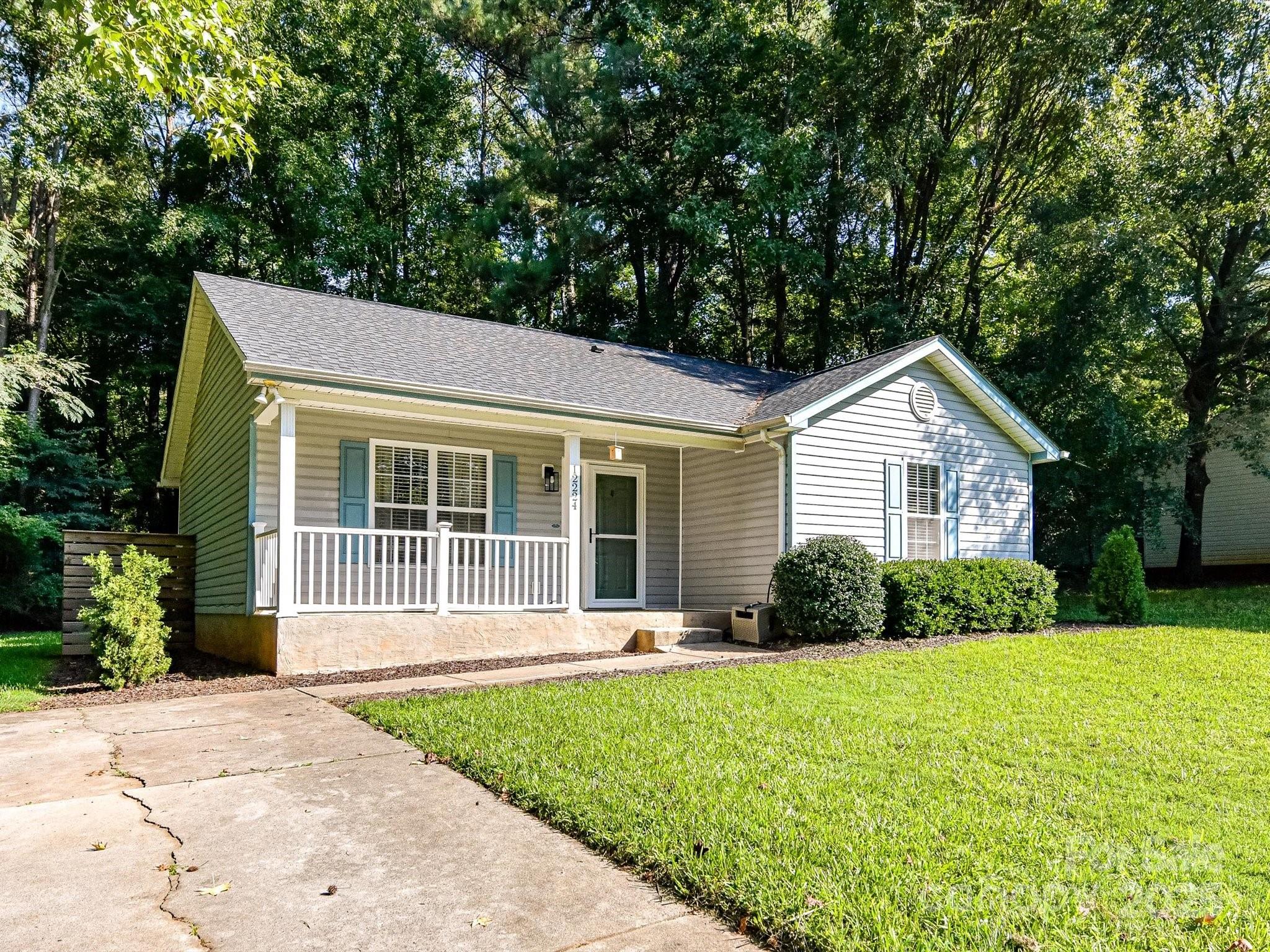 12224 Lullingstone Road Pineville, NC 28134 - Photo 2 of 26 a front view of a house with a yard