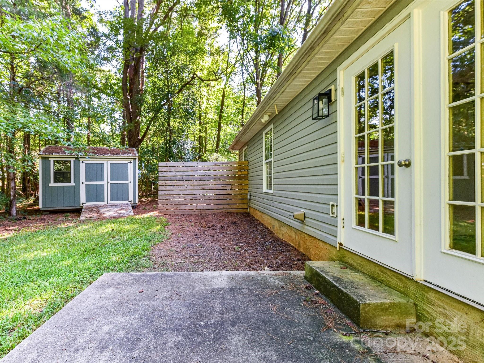12224 Lullingstone Road Pineville, NC 28134 - Photo 21 of 26 a view of a house with a yard