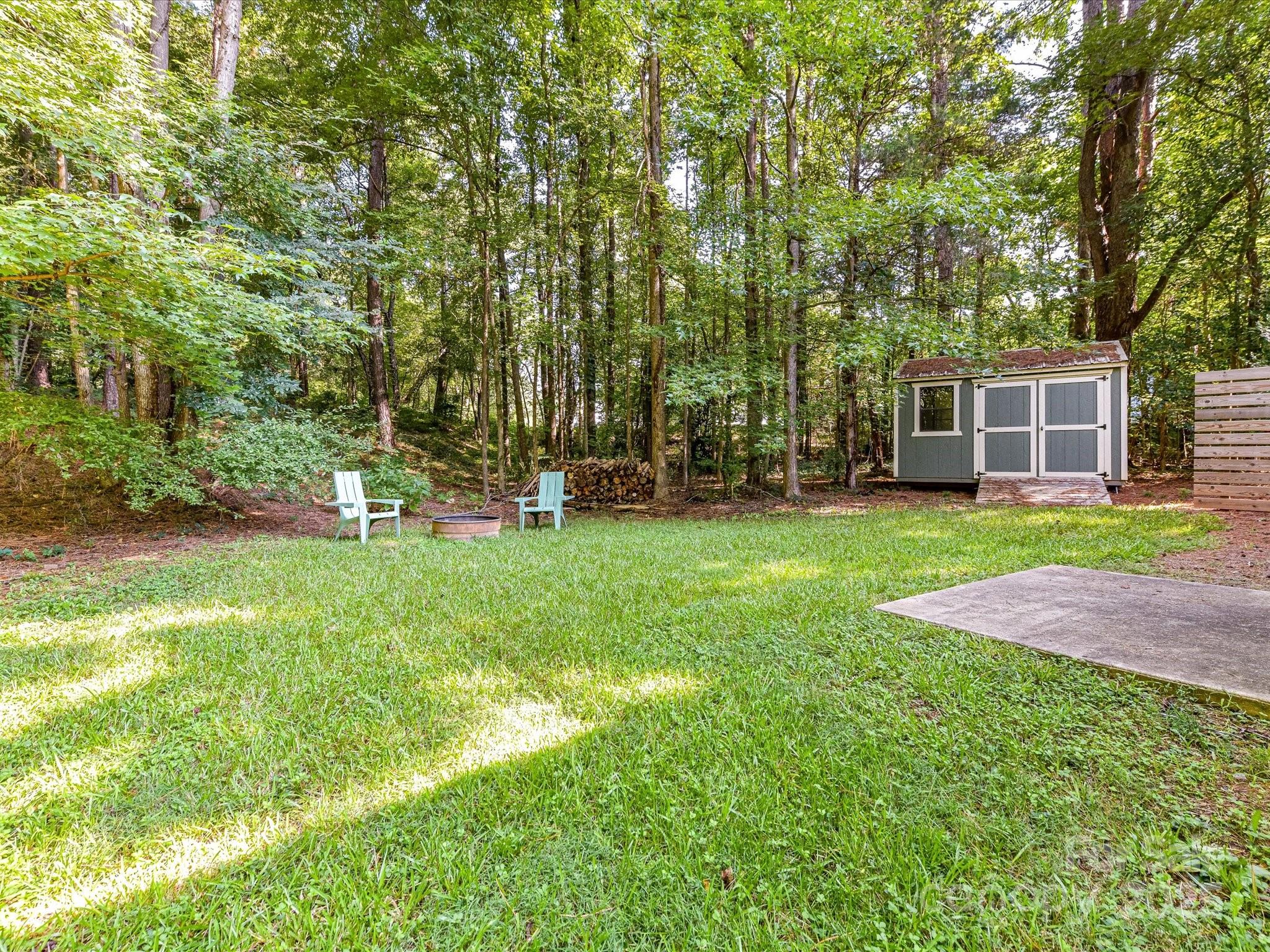 12224 Lullingstone Road Pineville, NC 28134 - Photo 22 of 26 a view of a house with backyard and a tree