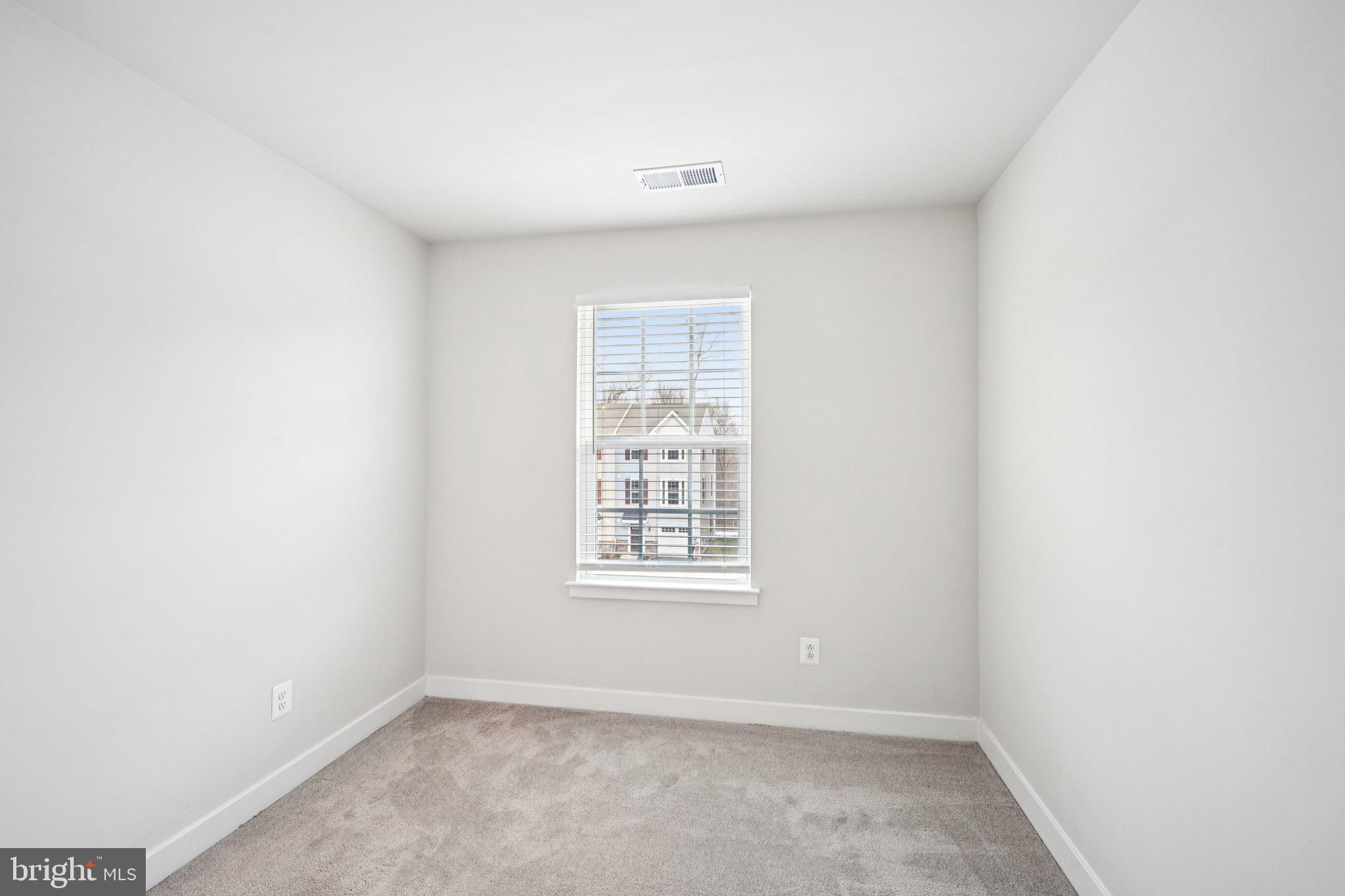 2055 Rivers Drive Newark, DE 19702 - Photo 21 of 32 a view of an empty room with a window