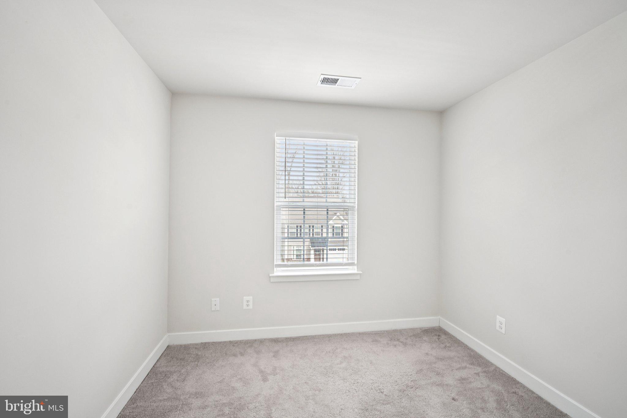 2055 Rivers Drive Newark, DE 19702 - Photo 23 of 32 an empty room with windows
