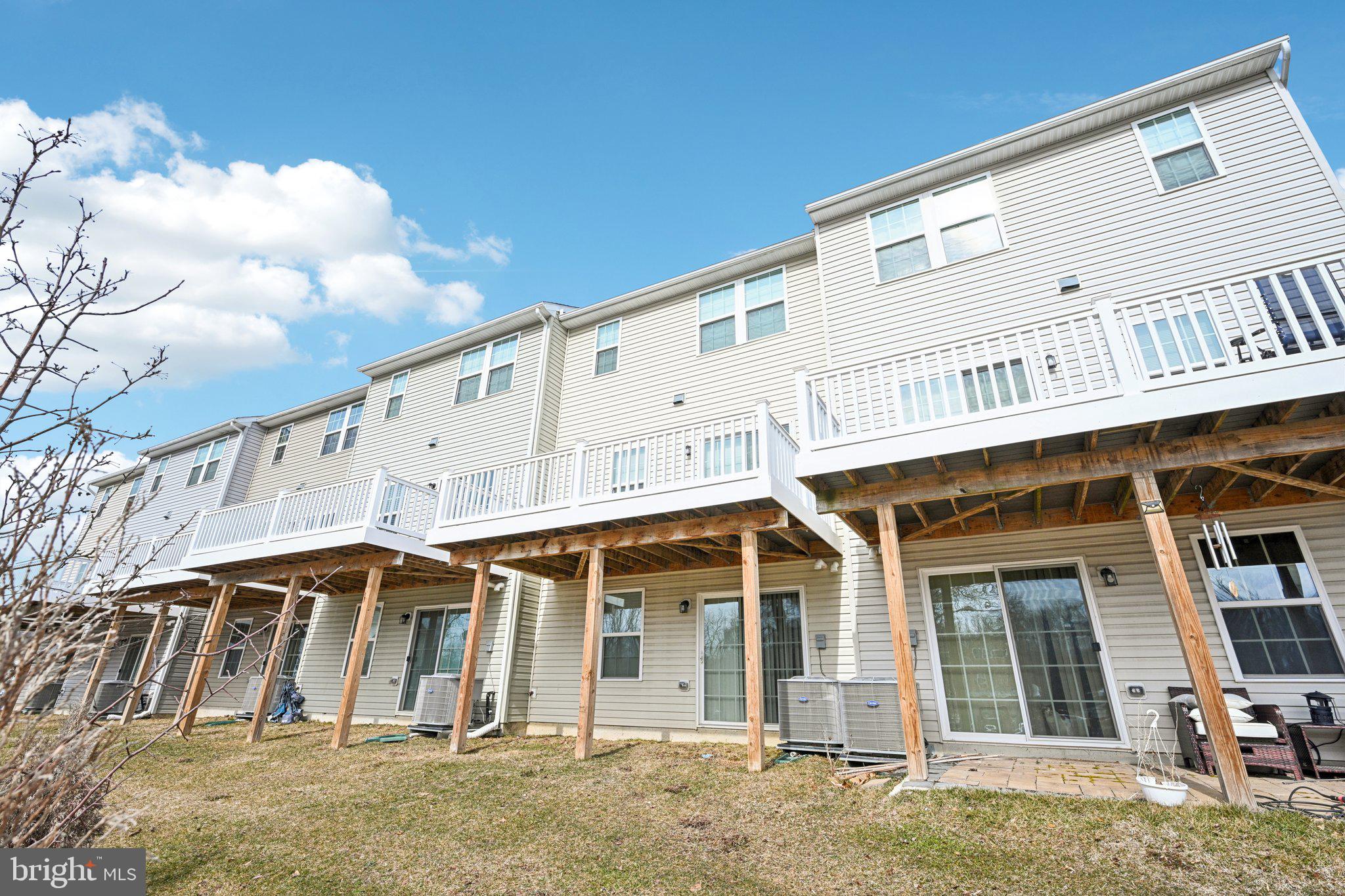 2055 Rivers Drive Newark, DE 19702 - Photo 31 of 32 a view of a white house with large windows