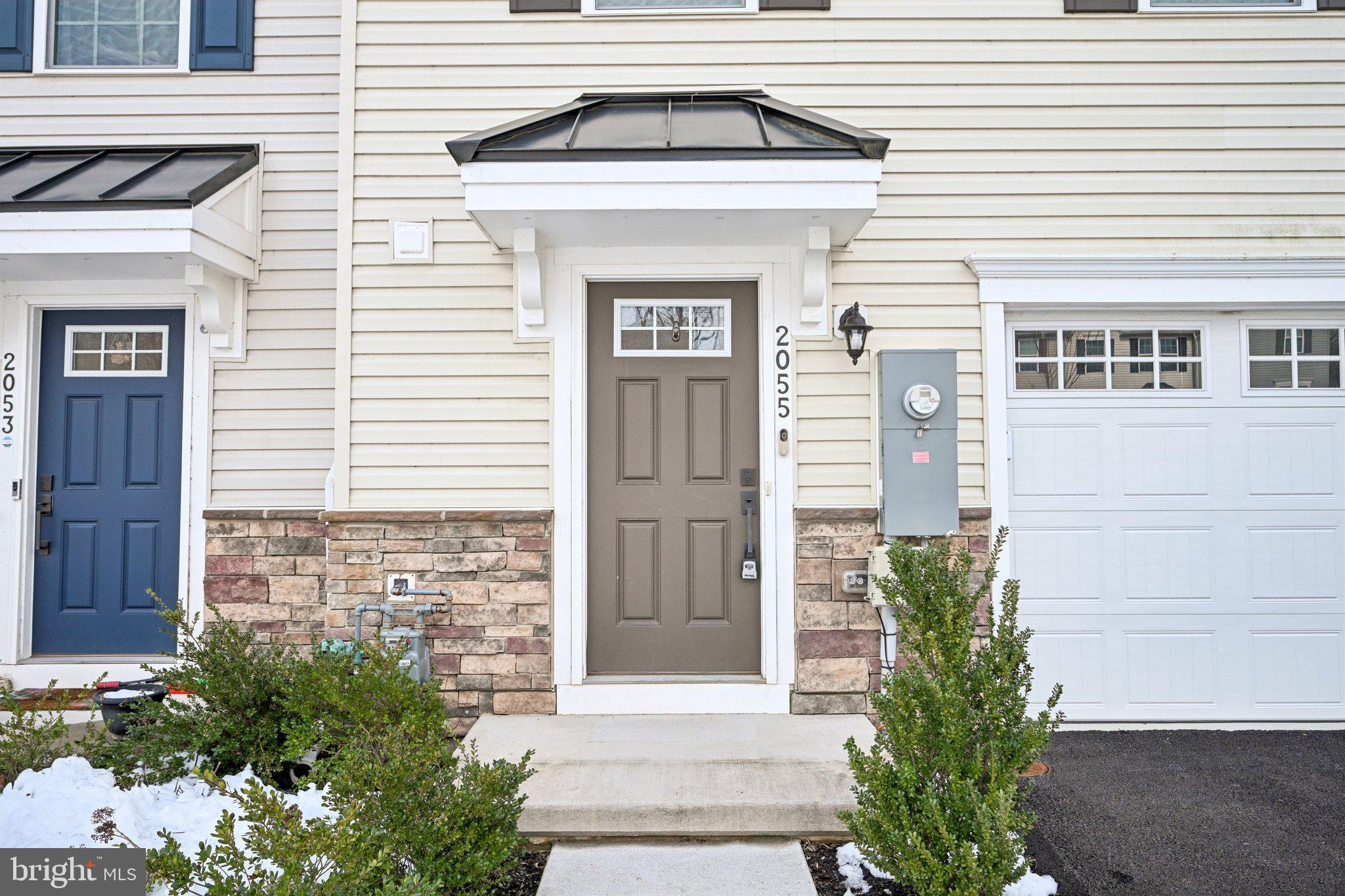 2055 Rivers Drive Newark, DE 19702 - Photo 4 of 32 a front view of a house with a garage