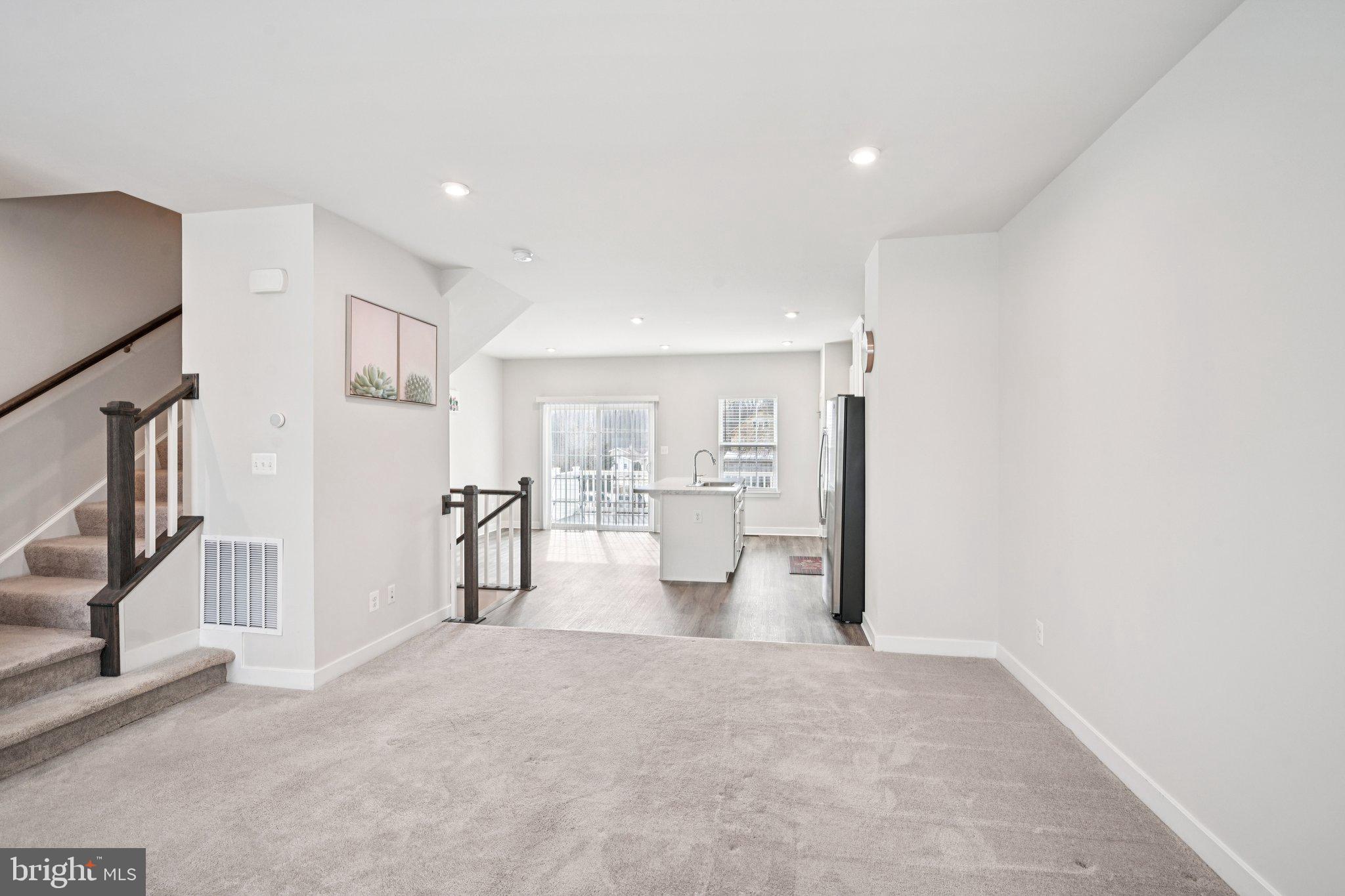 2055 Rivers Drive Newark, DE 19702 - Photo 8 of 32 a view of a living room and chandelier
