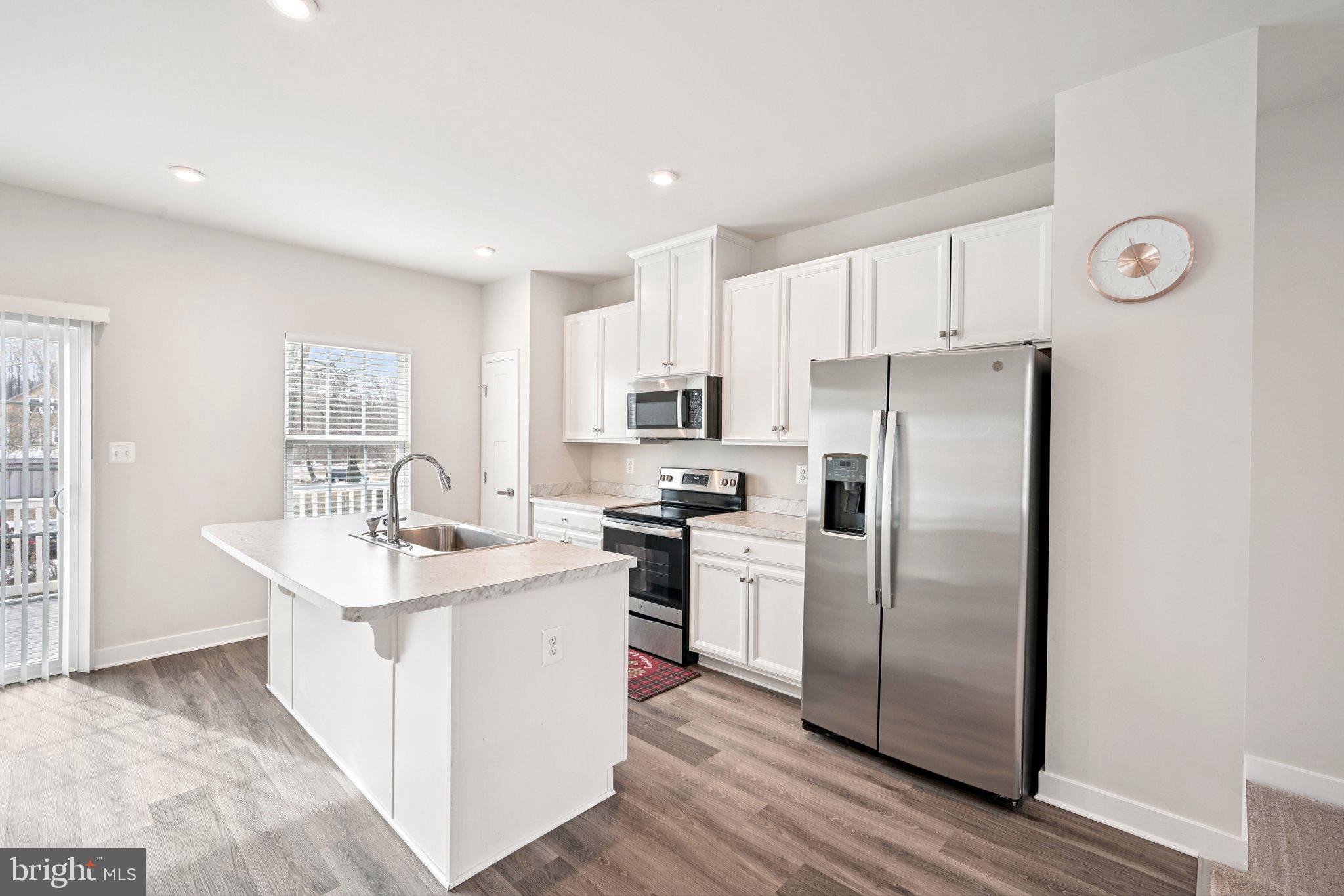 2055 Rivers Drive Newark, DE 19702 - Photo 9 of 32 a kitchen with stainless steel appliances a refrigerator sink and microwave