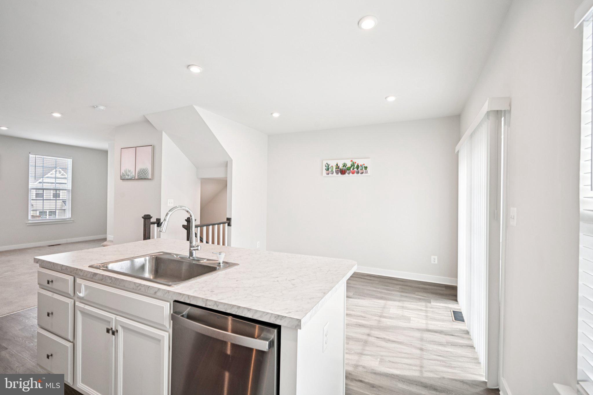 2055 Rivers Drive Newark, DE 19702 - Photo 10 of 32 a kitchen with a sink and a refrigerator