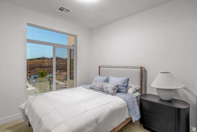 2768 Becco Trail, Unit 63 St. George, UT 84770 - Photo 16 of 27 View of carpeted bedroom