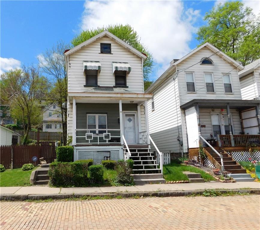 725 School Street McKees Rocks, PA 15136 - Photo 1 of 14 a front view of a house with a yard