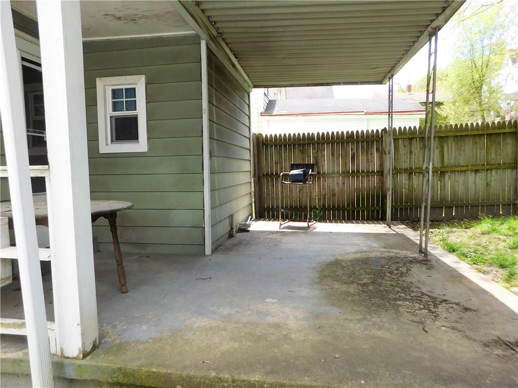 725 School Street McKees Rocks, PA 15136 - Photo 11 of 14 a backyard of a house with lots of green space