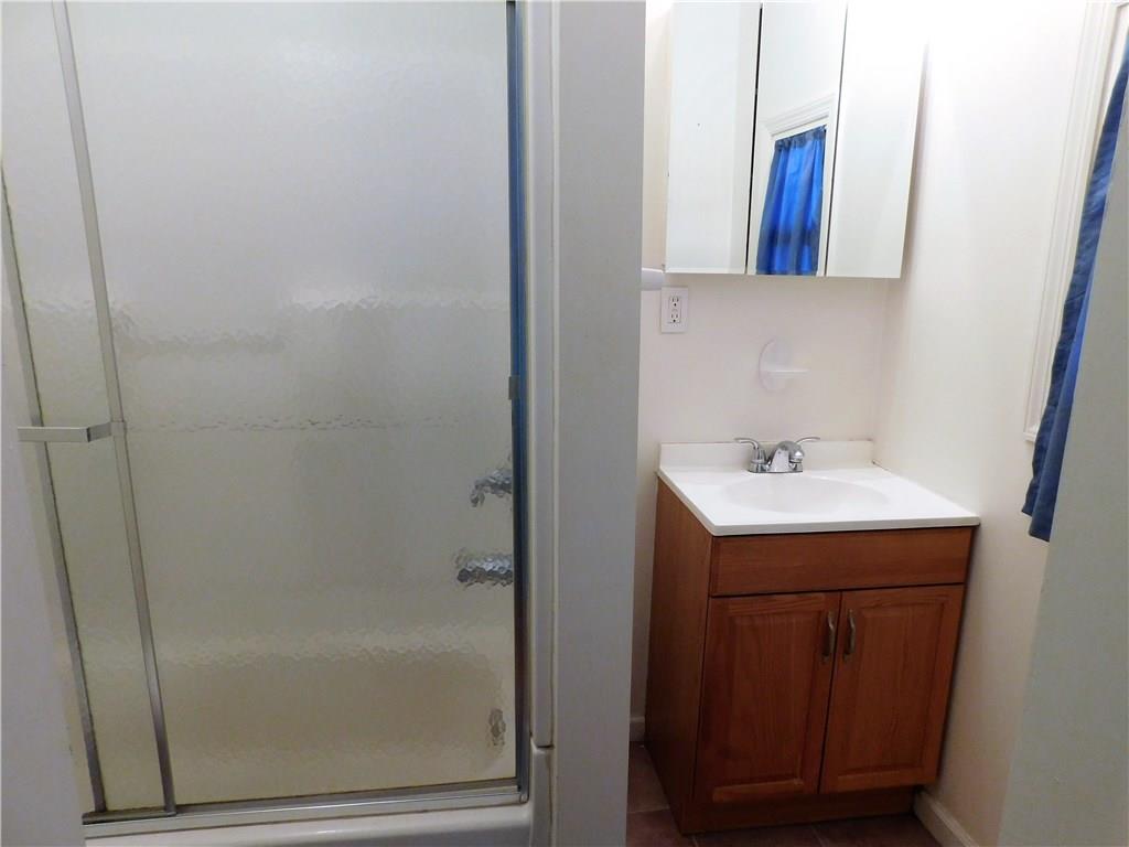 725 School Street McKees Rocks, PA 15136 - Photo 7 of 14 a bathroom with a sink and mirror