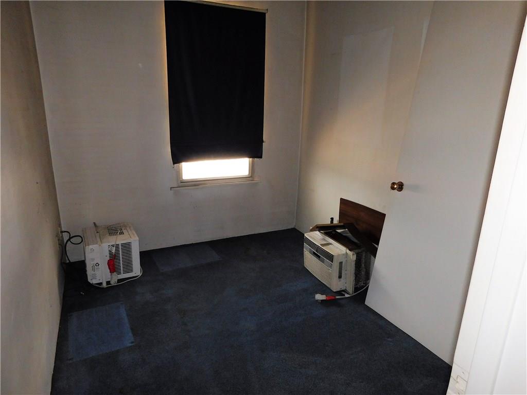 725 School Street McKees Rocks, PA 15136 - Photo 10 of 14 a room with a wooden floor and a window