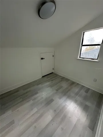 a bathroom with a sink a toilet a mirror and shower