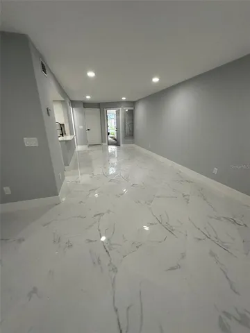 a room with utility cabinets and a sink