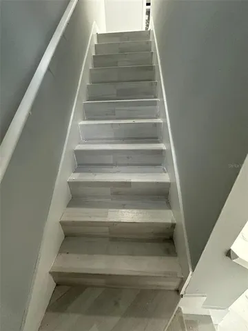 an empty room with wooden floor