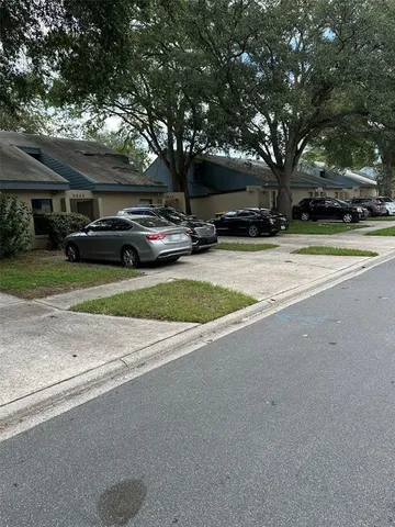 a view of street with parked cars