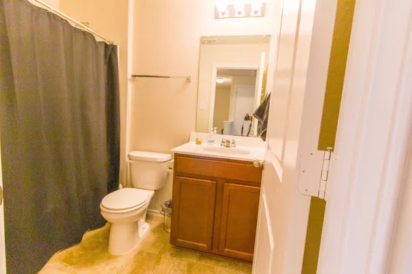 a bathroom with a shower and a toilet