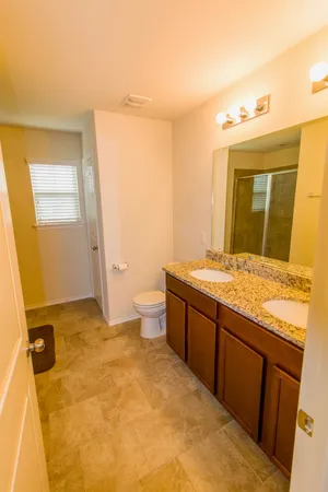 a bedroom with a bed and cabinets