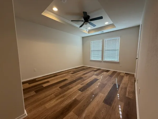a view of an empty room and a window