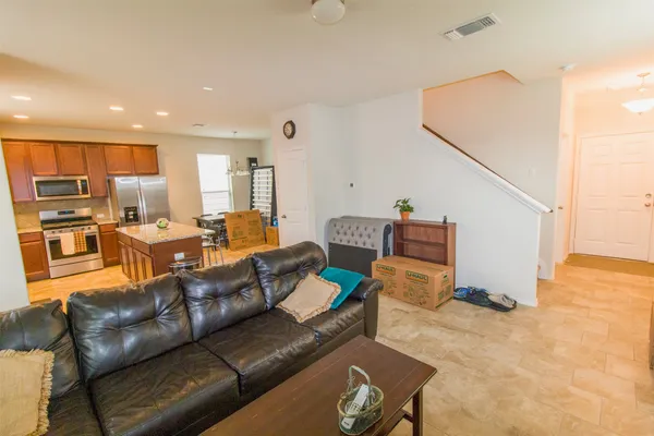 a kitchen that has a lot of cabinets in it