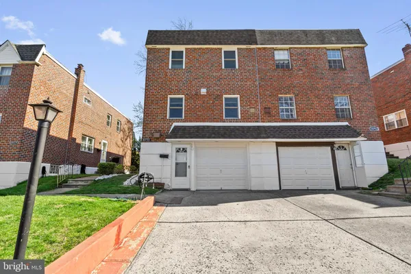 a view of a building with a yard