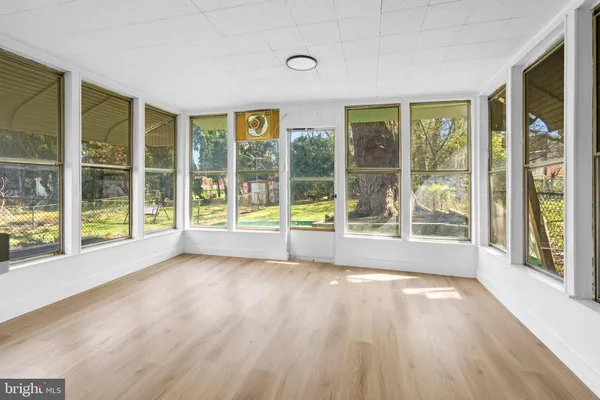a view of an entryway with wooden floor
