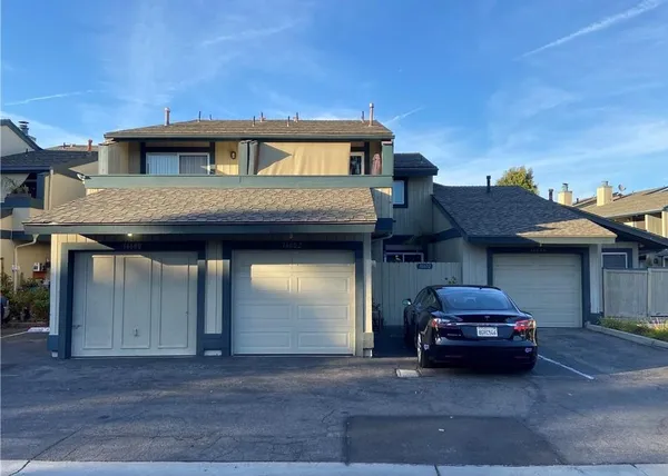 a car parked in front of a house