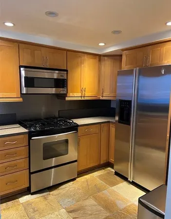 a kitchen with a sink and a cabinet