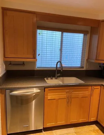 a bathroom with a toilet a sink and a mirror