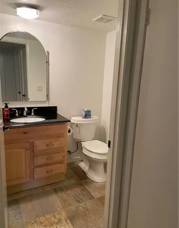 a view of an empty room with a fan