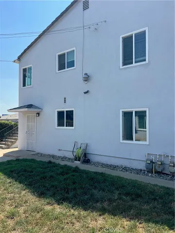 a house view with a backyard space