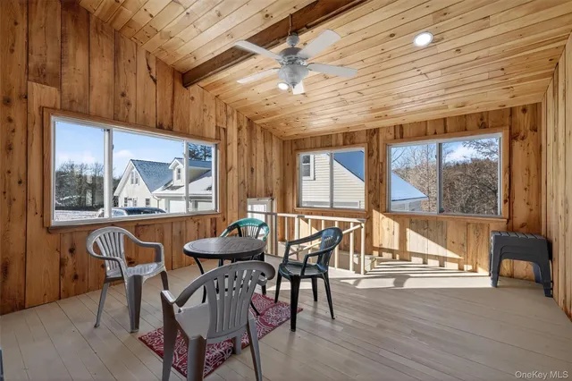 a view of a dining room with furniture window and outside view