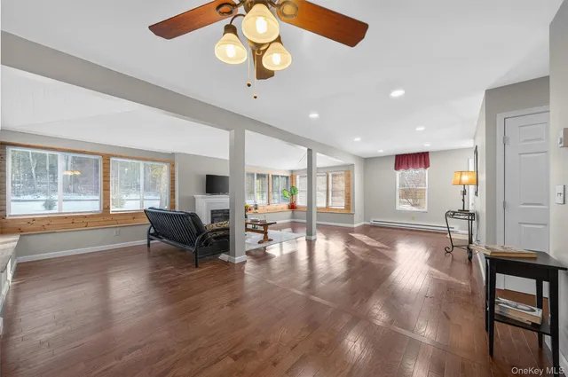 a view of a dining room with furniture wooden floor and chandelier