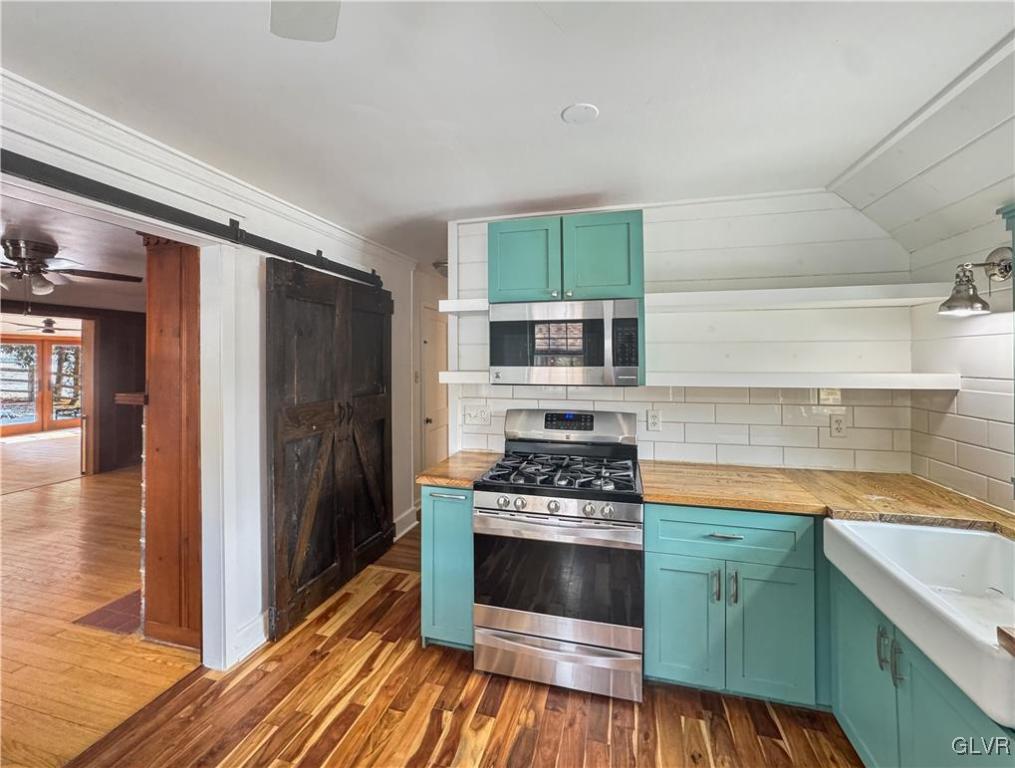3213 Center Street Bethlehem, PA 18017 - Photo 14 of 38 a kitchen with a stove and a refrigerator