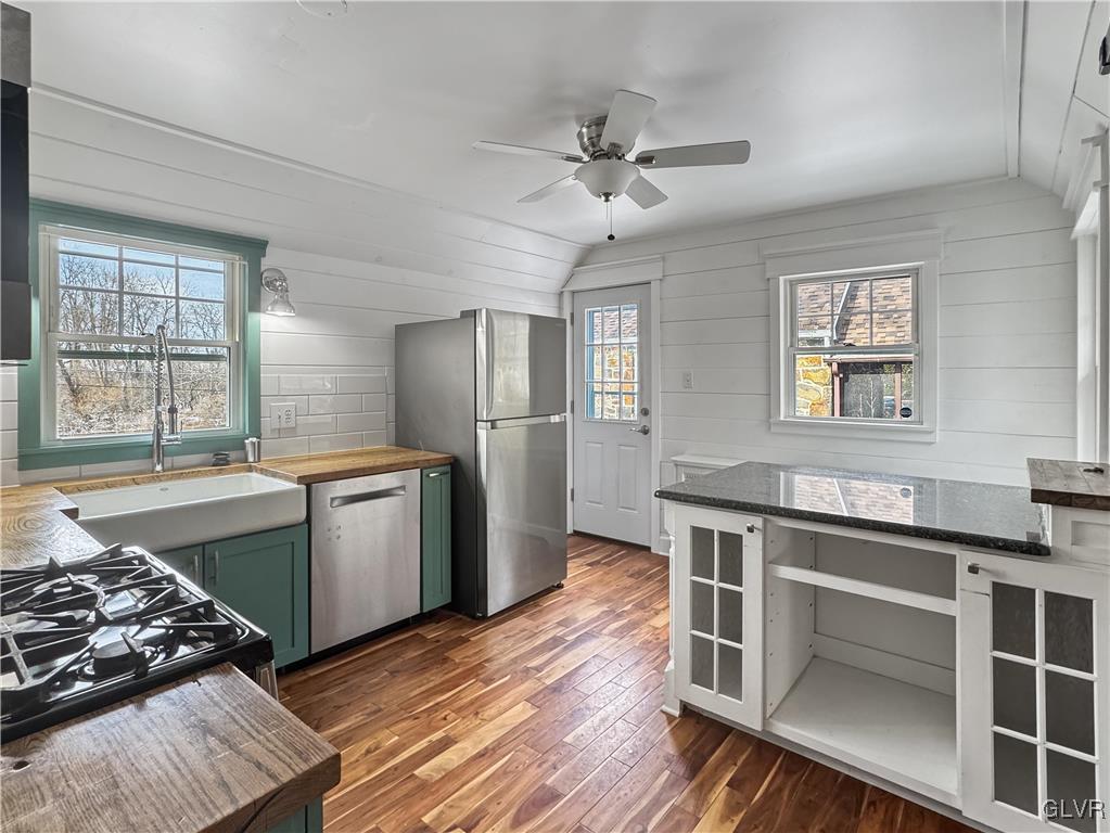 3213 Center Street Bethlehem, PA 18017 - Photo 15 of 38 a kitchen with stainless steel appliances granite countertop a sink stove and refrigerator