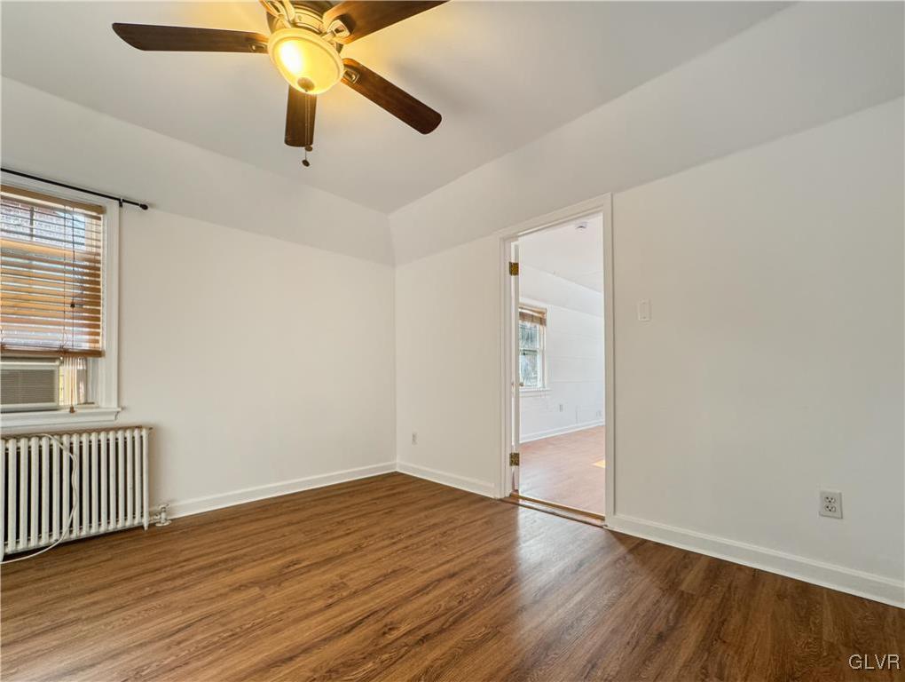 3213 Center Street Bethlehem, PA 18017 - Photo 22 of 38 an empty room with wooden floor fan and windows