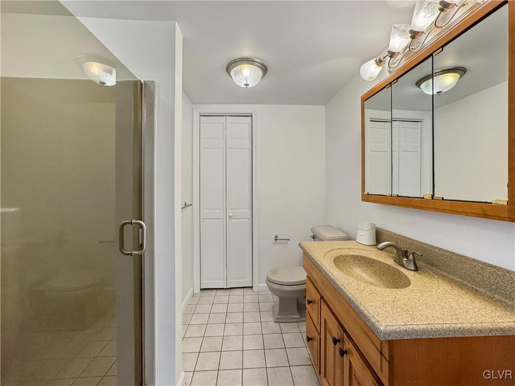 3213 Center Street Bethlehem, PA 18017 - Photo 28 of 38 a bathroom with a granite countertop sink and a mirror