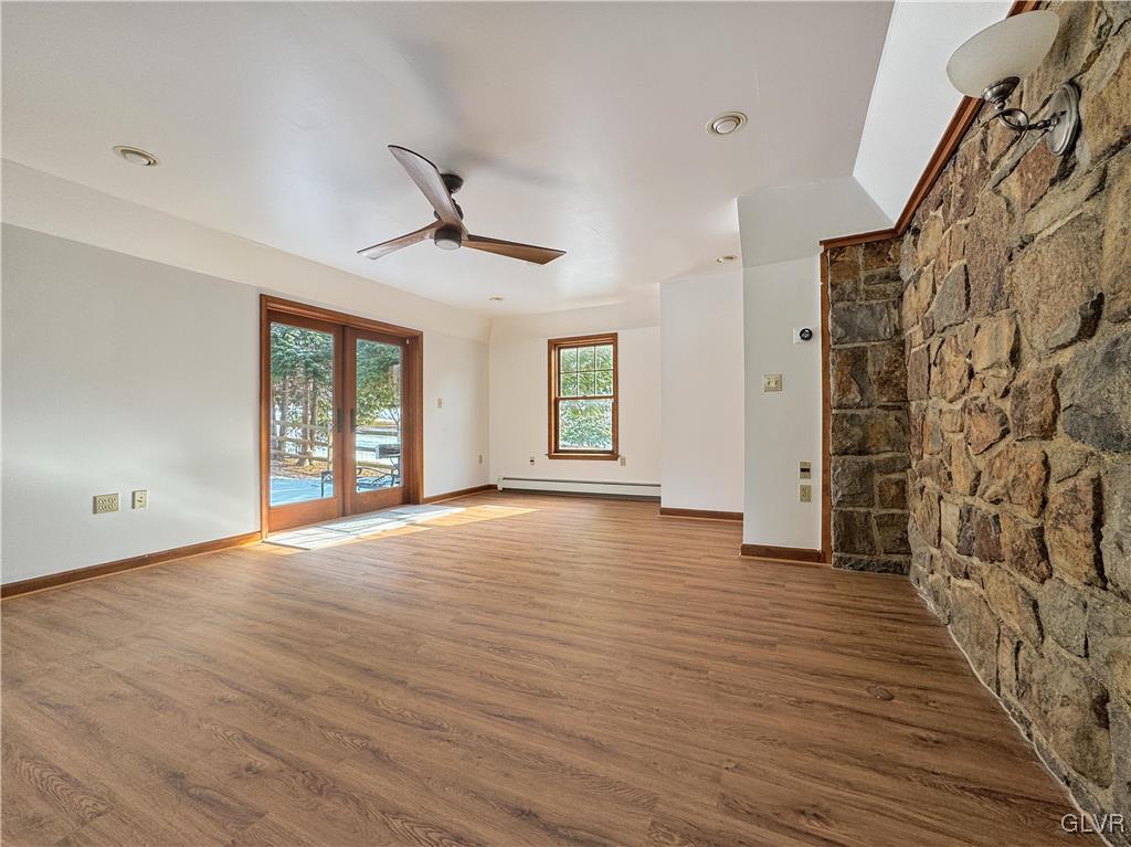 3213 Center Street Bethlehem, PA 18017 - Photo 7 of 38 a view of an empty room with wooden floor and a window