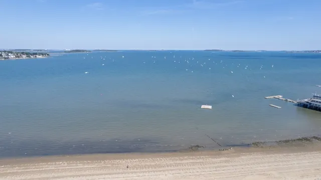 a kitchen with a refrigerator and a stove top oven