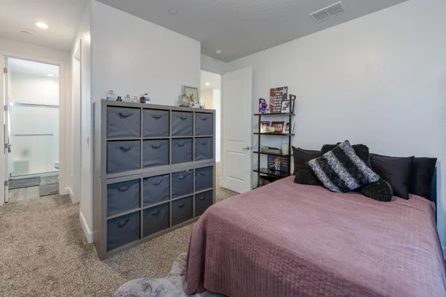 a bed room with a bed and a television