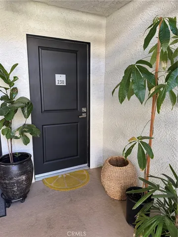 a view of a living room with a flat screen tv