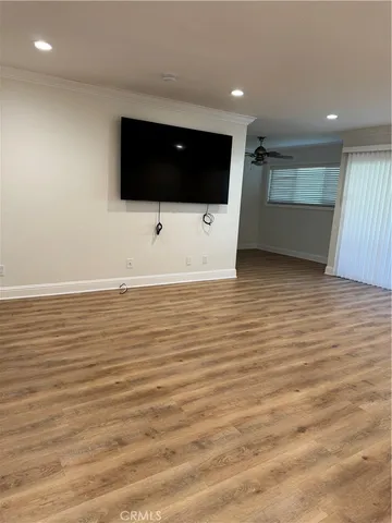 a kitchen with granite countertop a stove microwave and refrigerator
