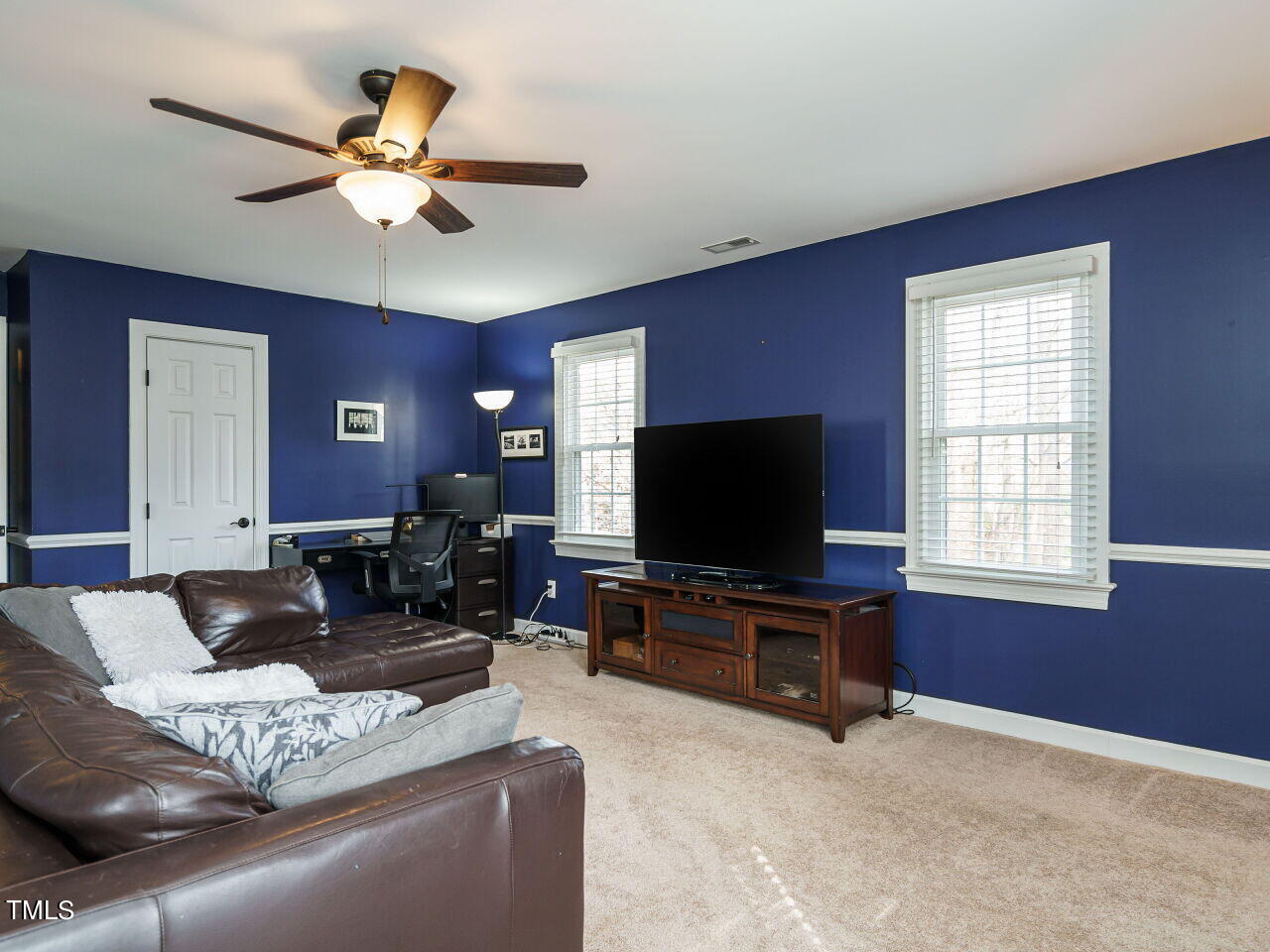 220 Custer Trail Cary, NC 27513 - Photo 20 of 31 a living room with furniture and a flat screen tv
