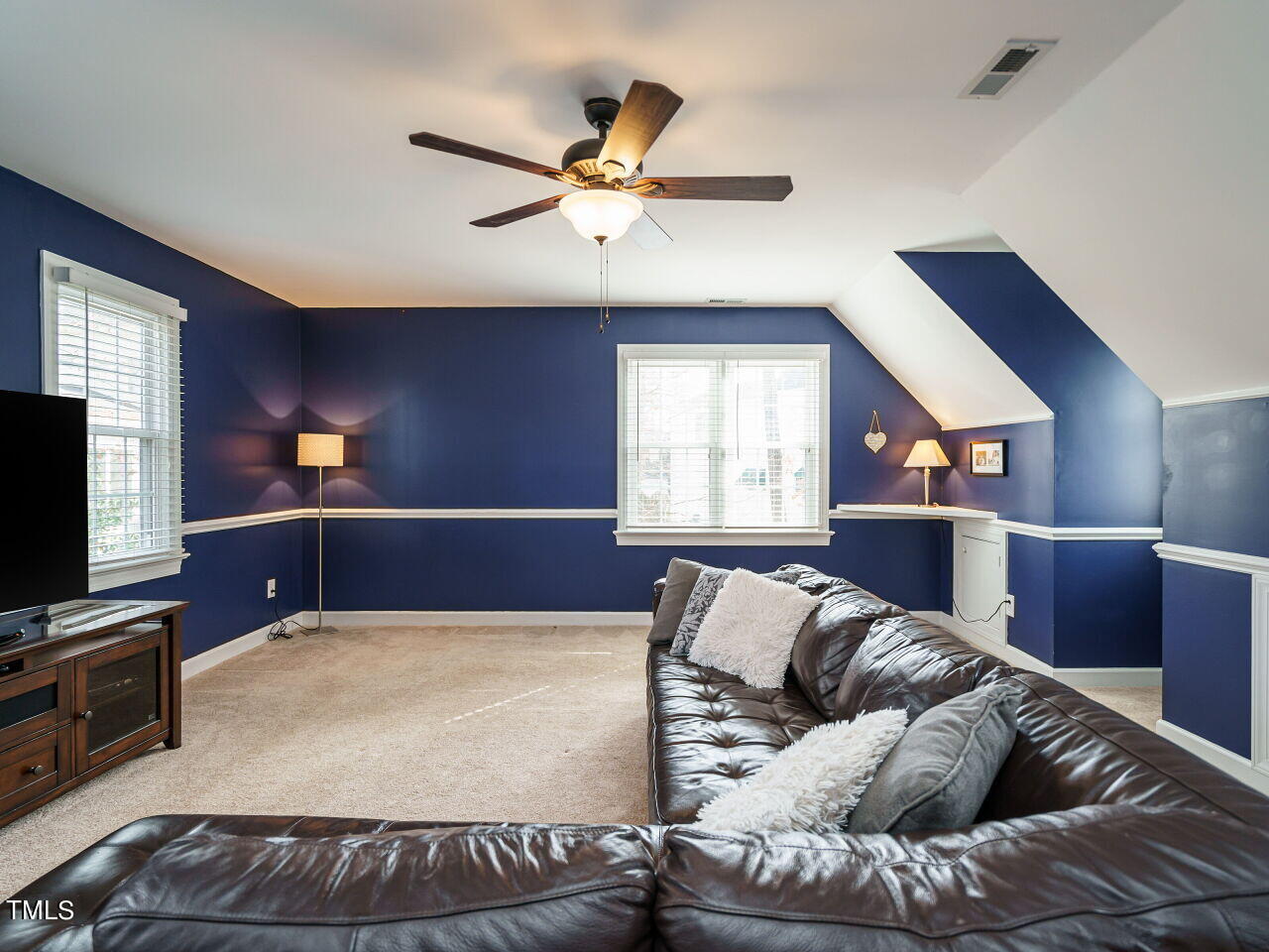 220 Custer Trail Cary, NC 27513 - Photo 21 of 31 a living room with furniture and a flat screen tv