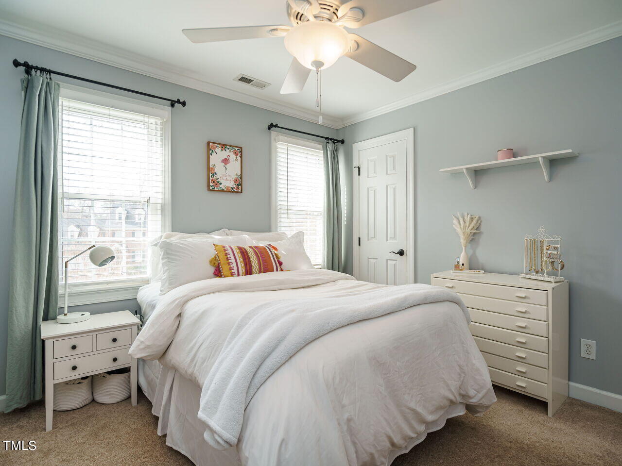 220 Custer Trail Cary, NC 27513 - Photo 22 of 31 a bedroom with a large bed and a chandelier