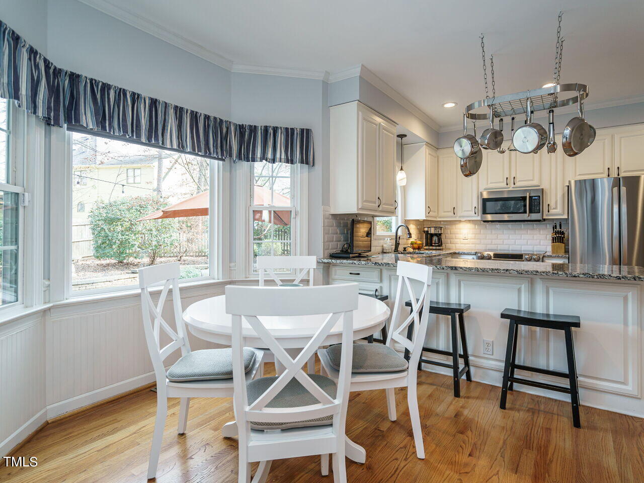 220 Custer Trail Cary, NC 27513 - Photo 5 of 31 a view of a dining room with furniture window and wooden floor
