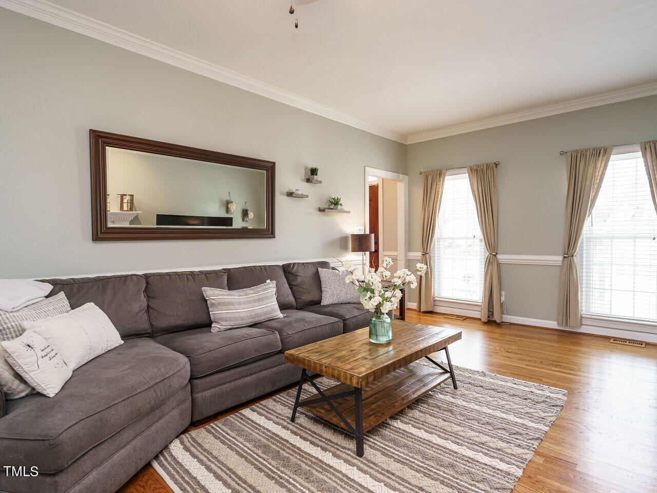 220 Custer Trail Cary, NC 27513 - Photo 9 of 31 a living room with furniture and a wooden floor