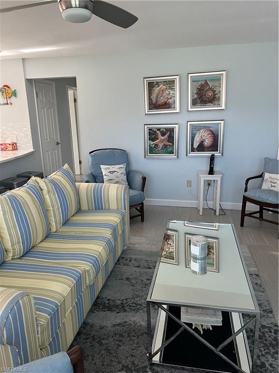 671 100th Avenue North Naples, FL 34108 - Photo 4 of 16 Living room with ceiling fan and dark hardwood / wood-style flooring