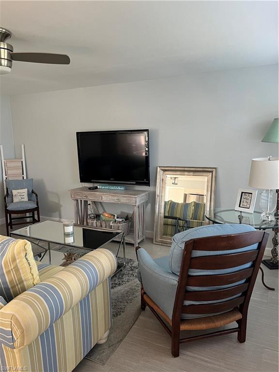 671 100th Avenue North Naples, FL 34108 - Photo 6 of 16 Living room featuring ceiling fan