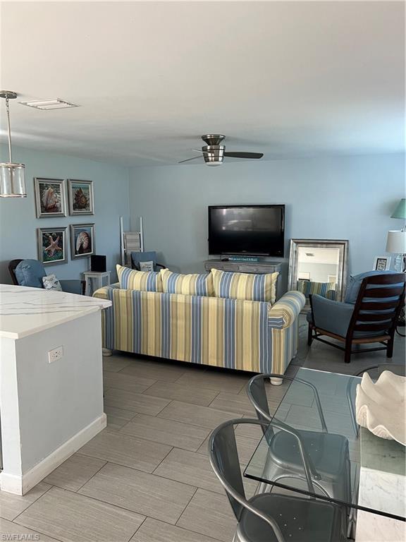 671 100th Avenue North Naples, FL 34108 - Photo 8 of 16 Living room featuring ceiling fan