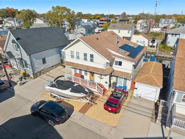 an aerial view of residential houses with outdoor space